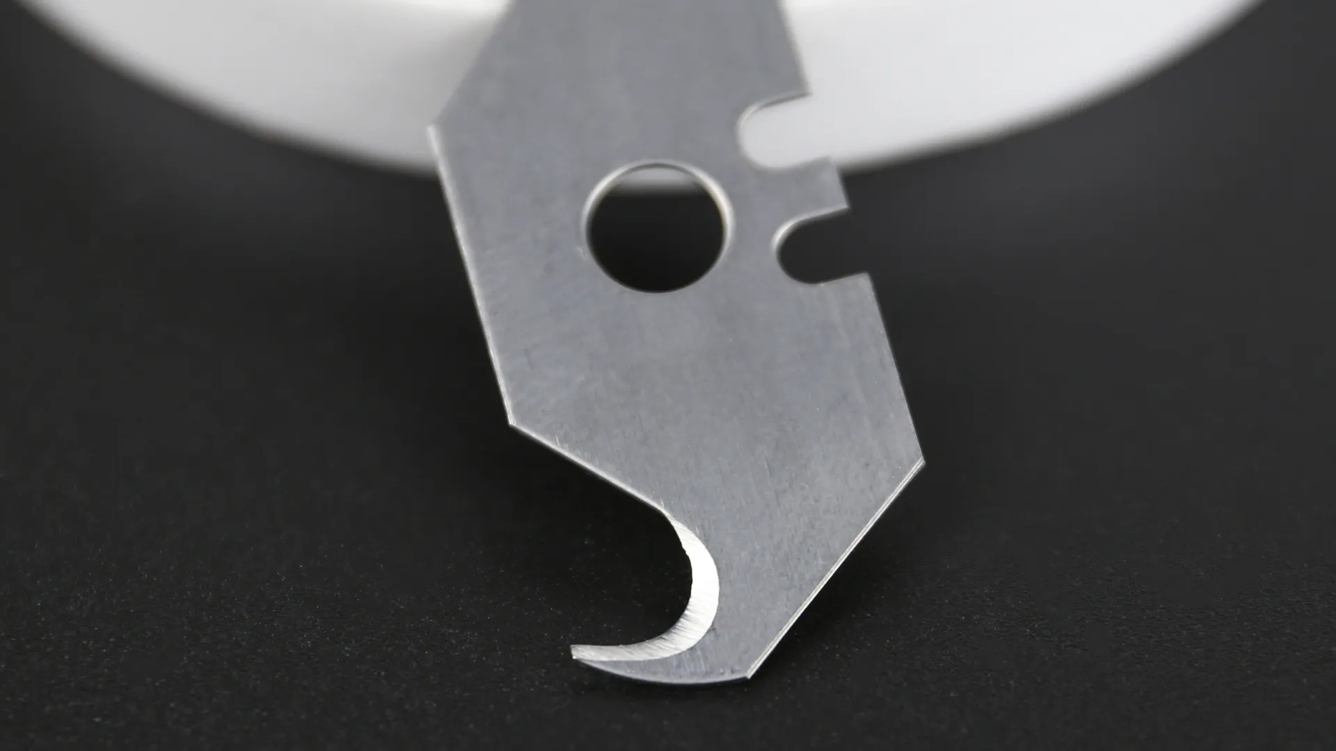 The blade covered by protective safety guard.