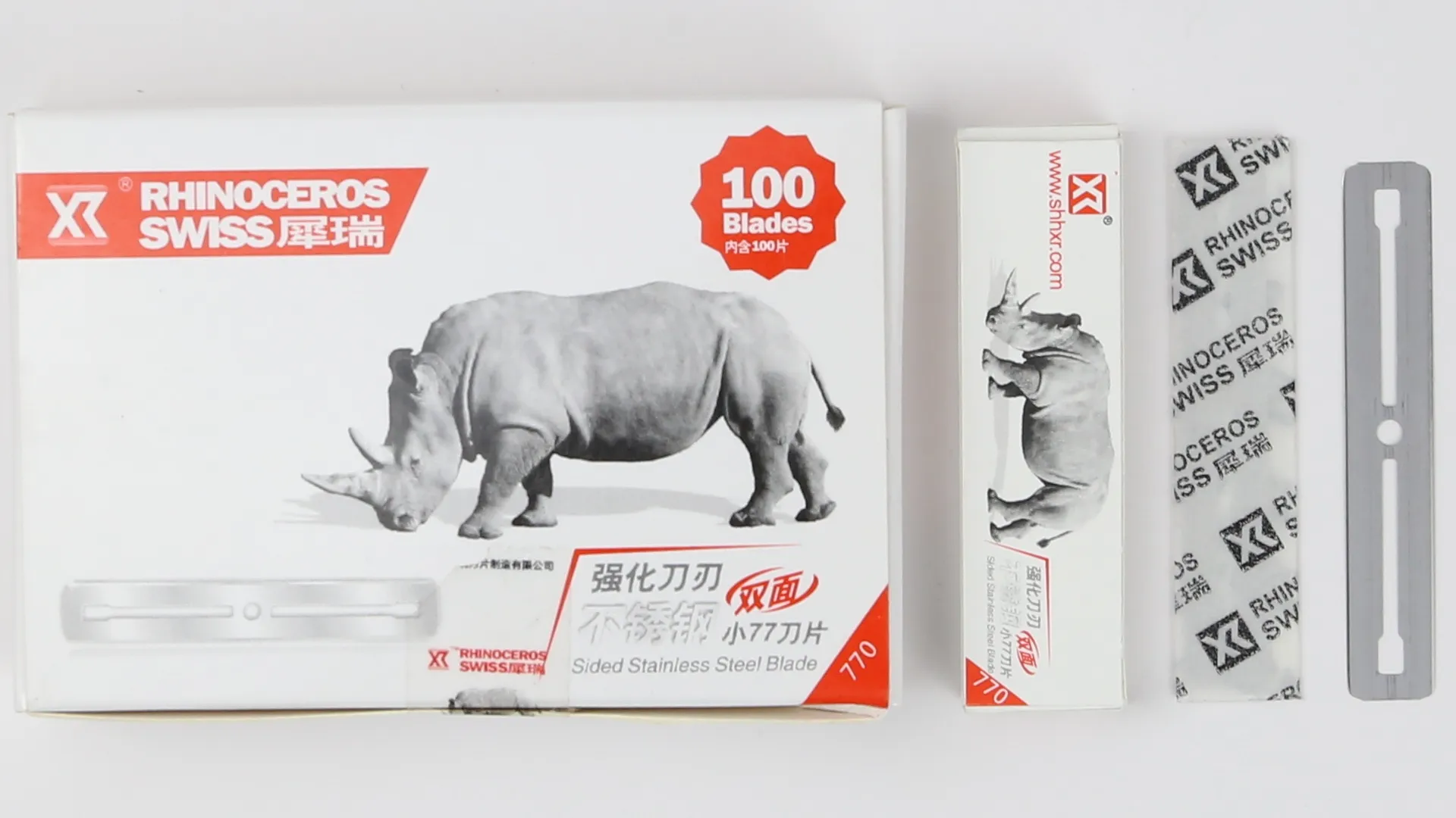 small straight razor blade in white box