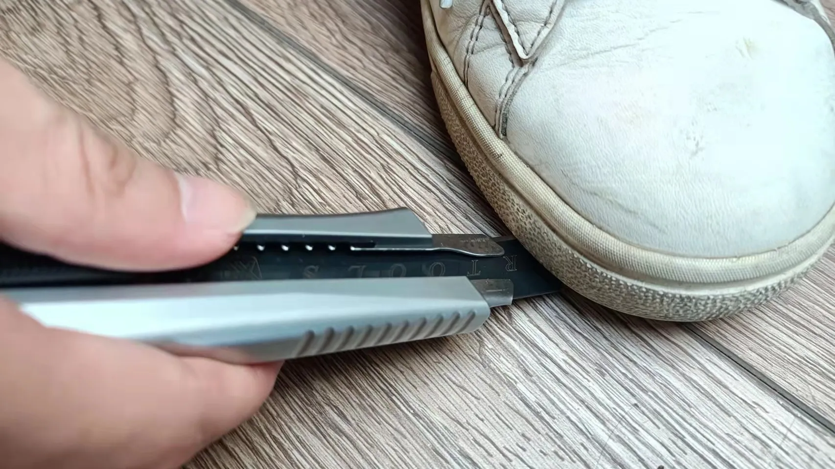 snap off the blade on the ground